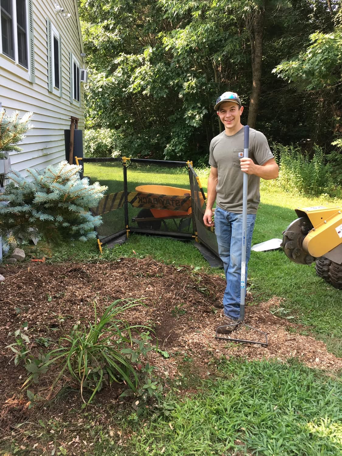 Justin Goodwin, owner of Goodwin Ground Services, standing with his equipment in Shapleigh, Maine